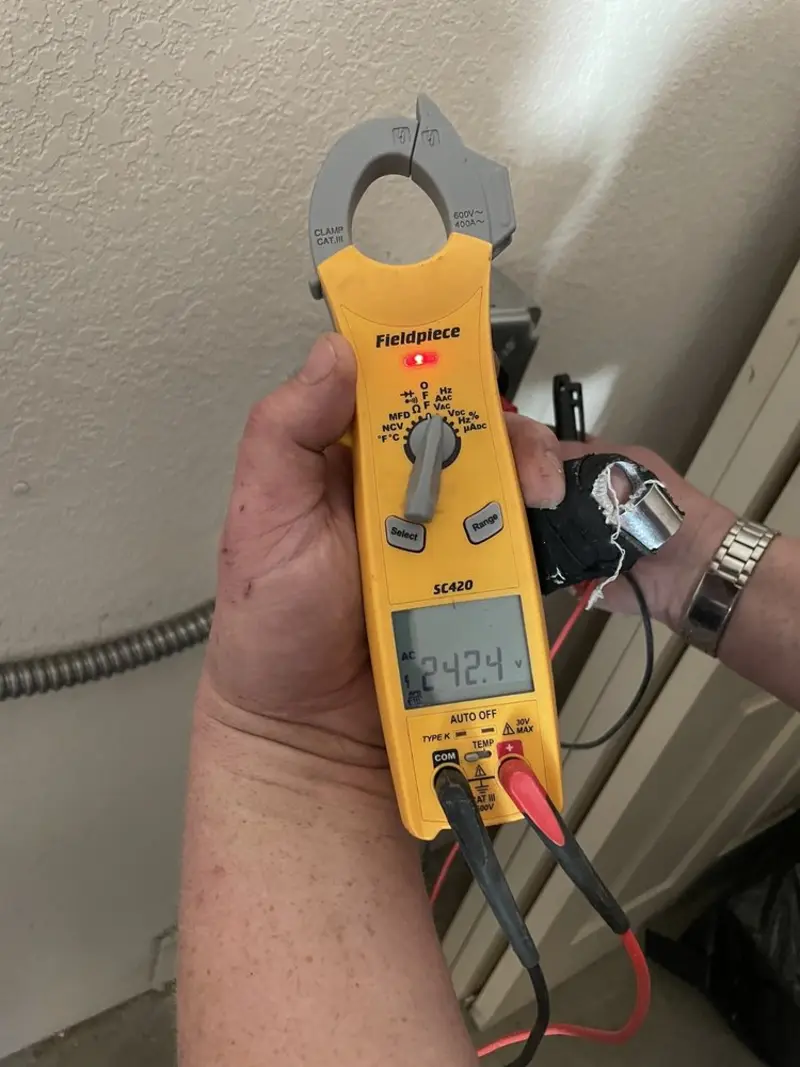 Voltage testing with clamp meter during Electrical Installation Services in Sandy Creek